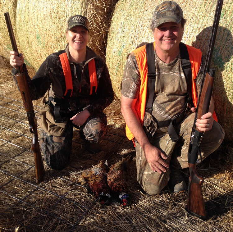 Dale and Becky displaying their phesants at Deadman Creek Outfitters
